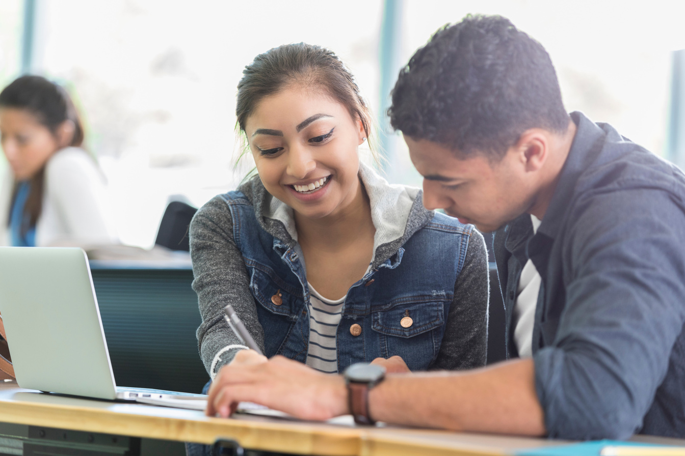 Young woman tutors college classmate